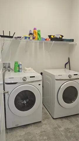 a utility room with dryer and washer