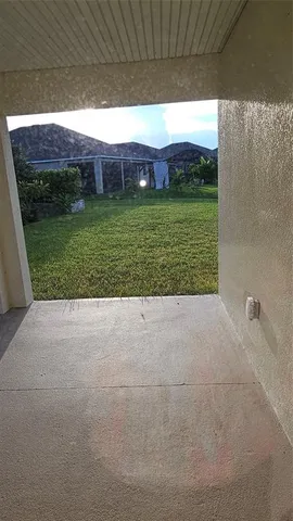 a view of a porch with a yard