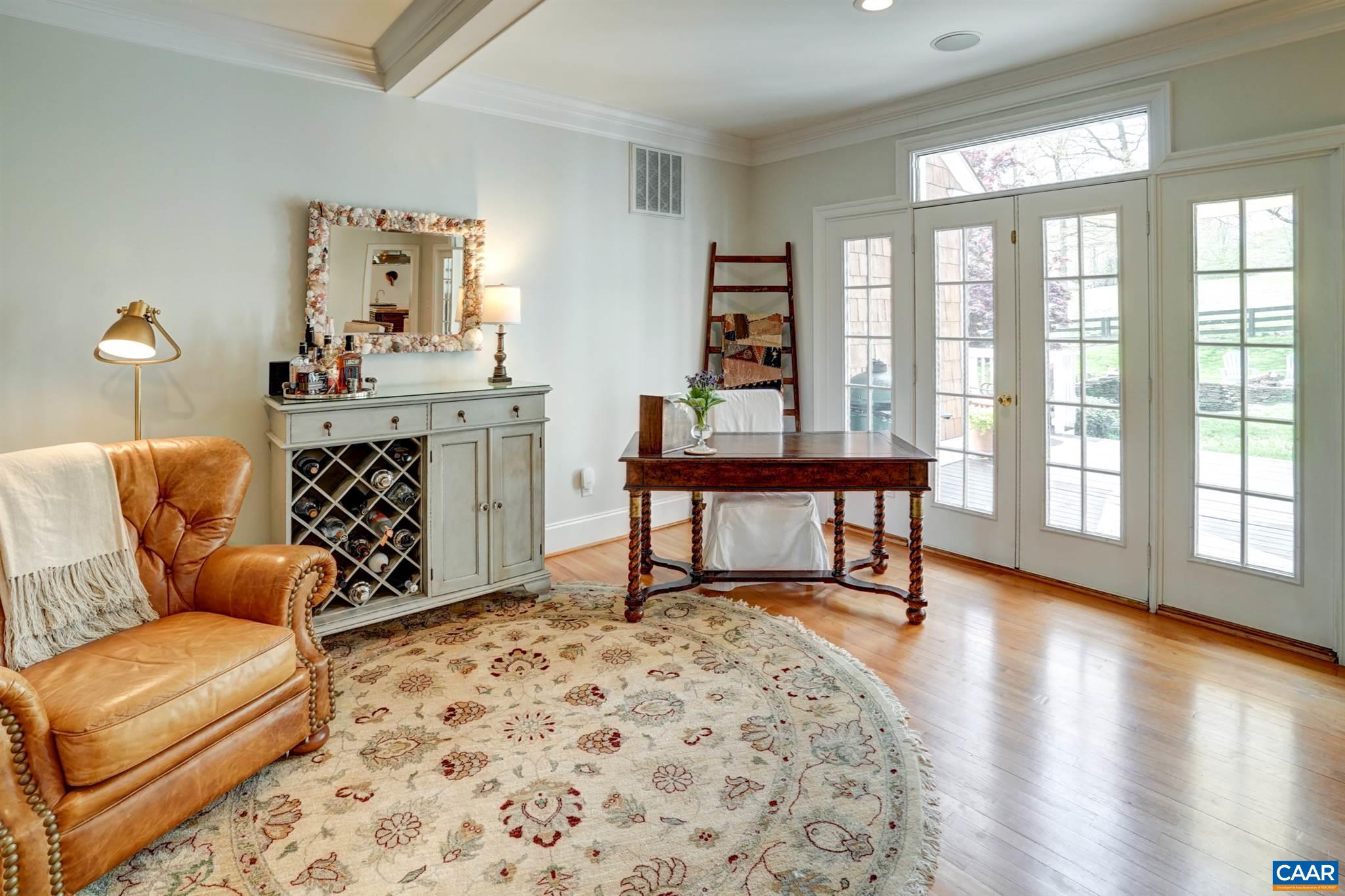 3315 Darby Road Keswick, VA 22947 - Photo 22 of 67 a living room with furniture and a large window