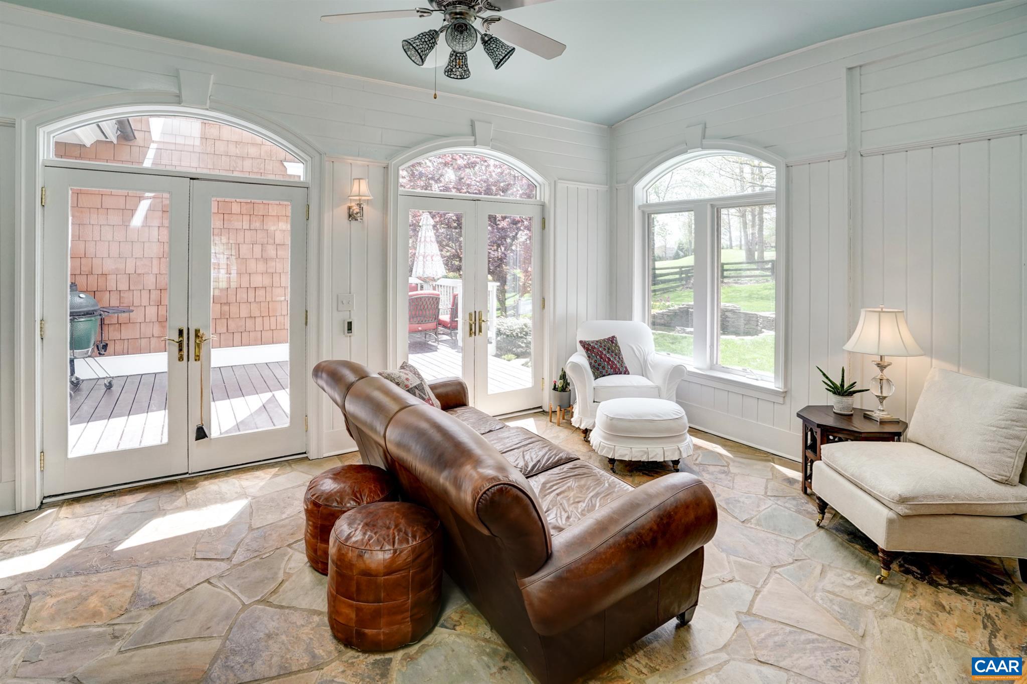 3315 Darby Road Keswick, VA 22947 - Photo 23 of 67 a living room with furniture chandelier and a large window