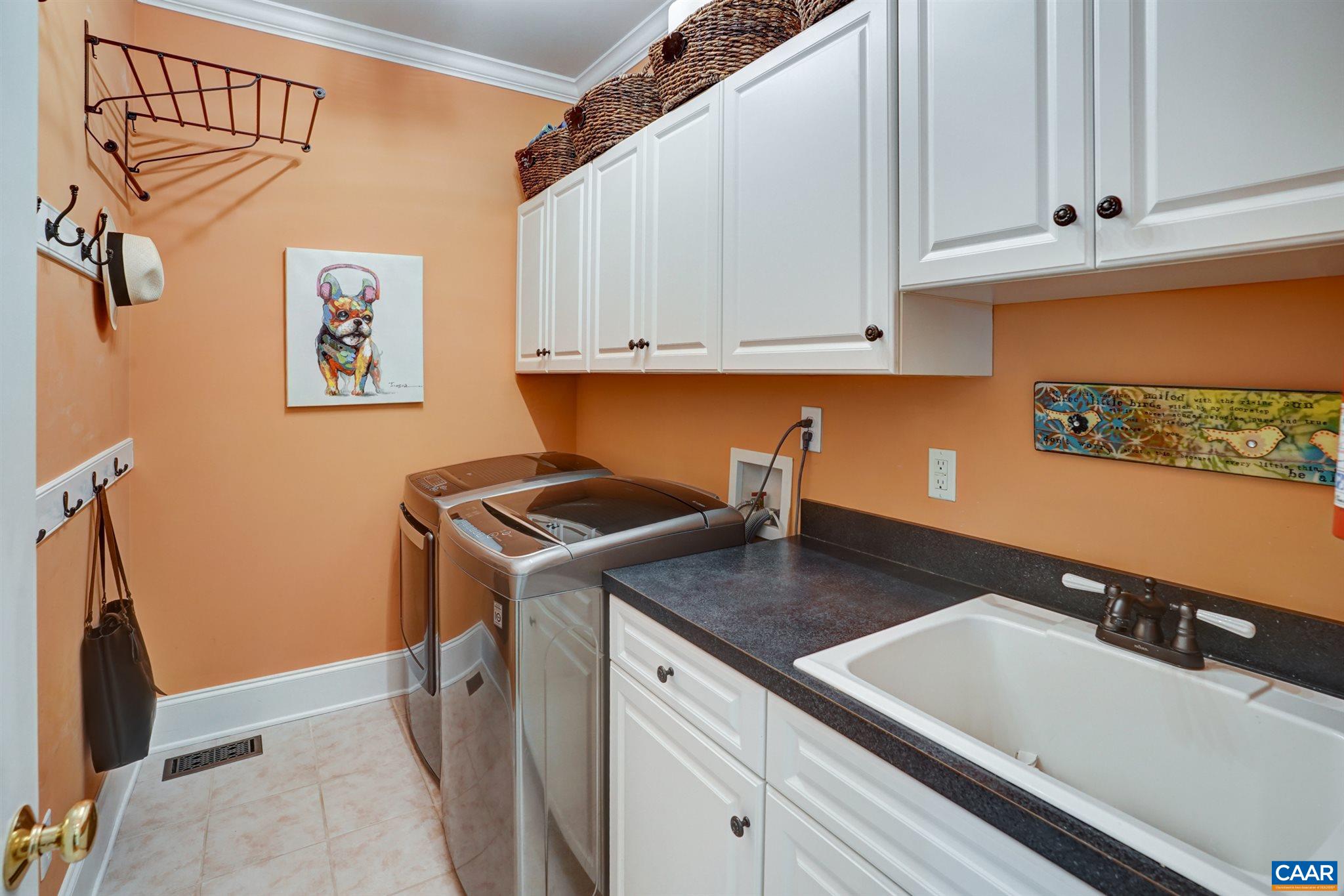 3315 Darby Road Keswick, VA 22947 - Photo 25 of 67 a kitchen with a sink and cabinets