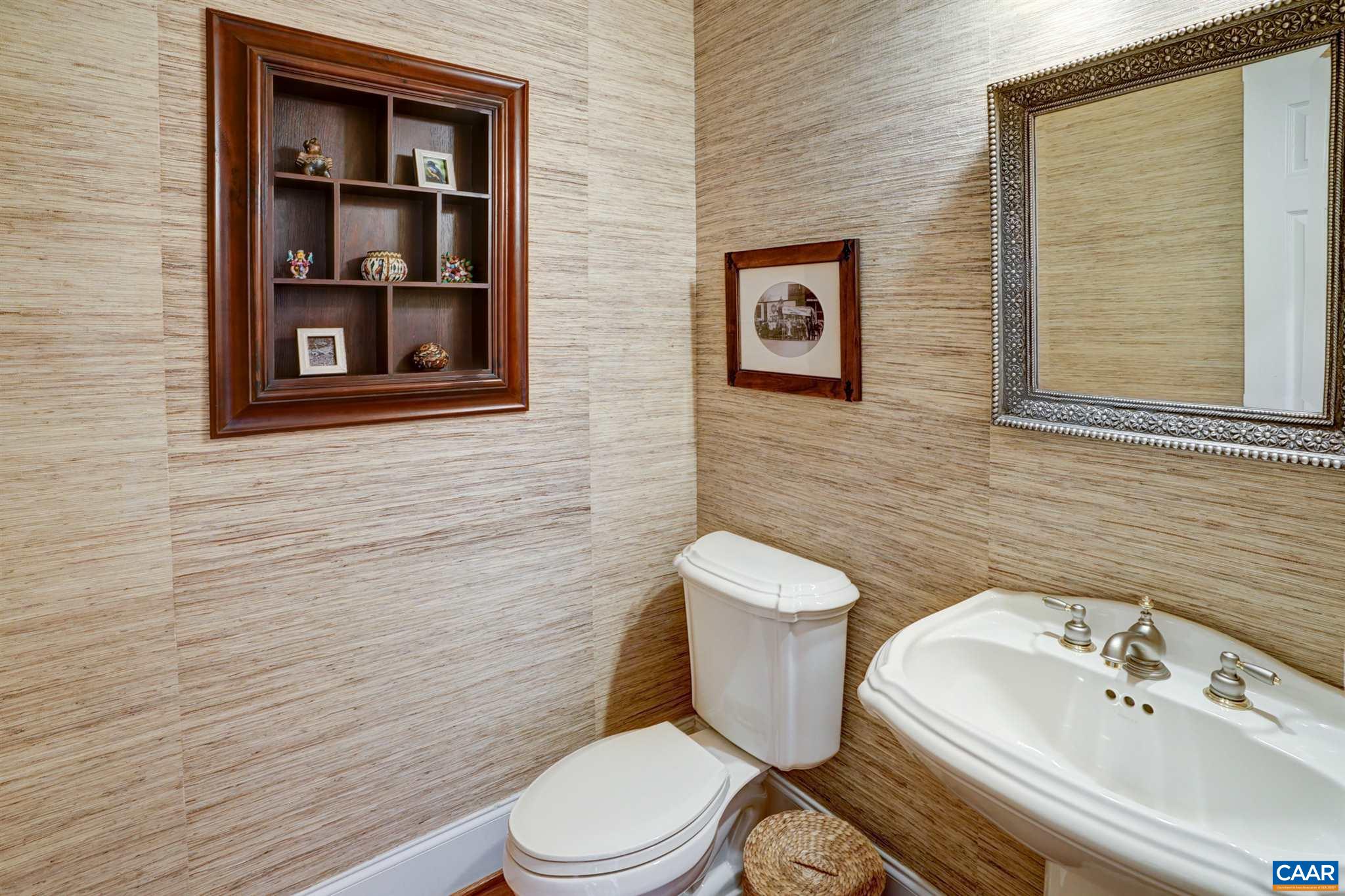 3315 Darby Road Keswick, VA 22947 - Photo 26 of 67 a white toilet sitting next to a bathroom sink
