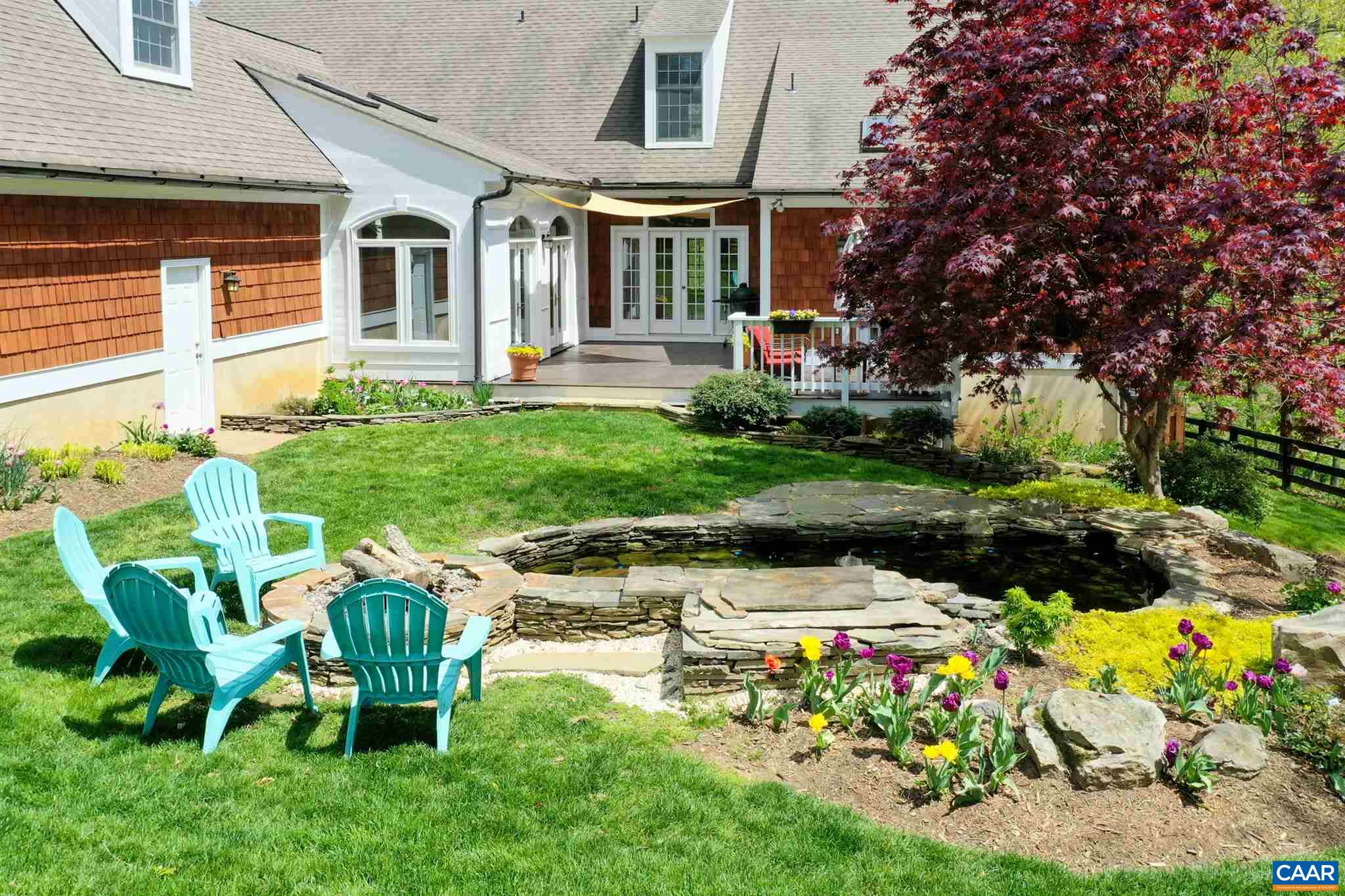 3315 Darby Road Keswick, VA 22947 - Photo 56 of 67 a view of backyard of house with outdoor seating and green space