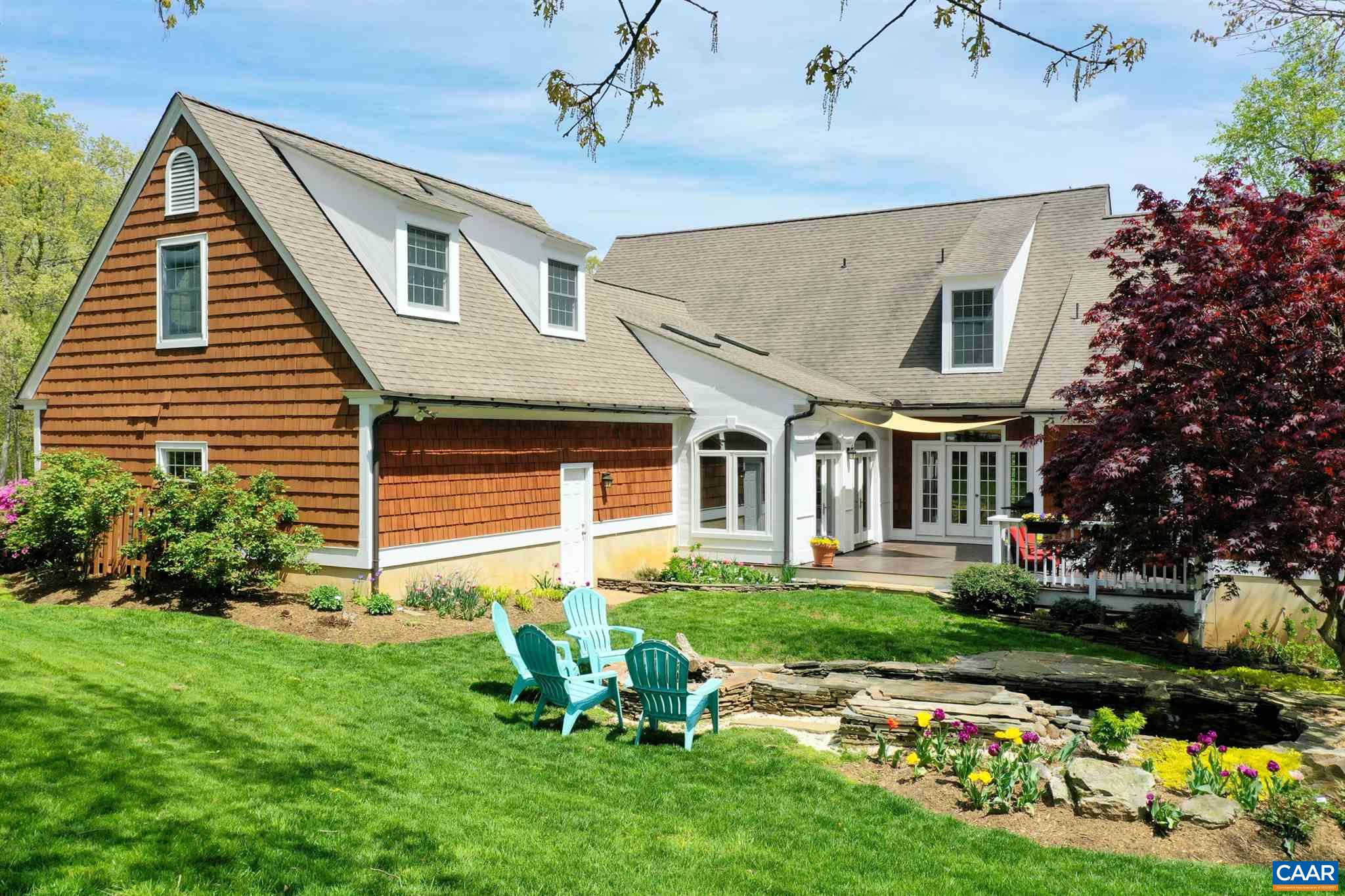 3315 Darby Road Keswick, VA 22947 - Photo 57 of 67 a front view of house with a garden and patio