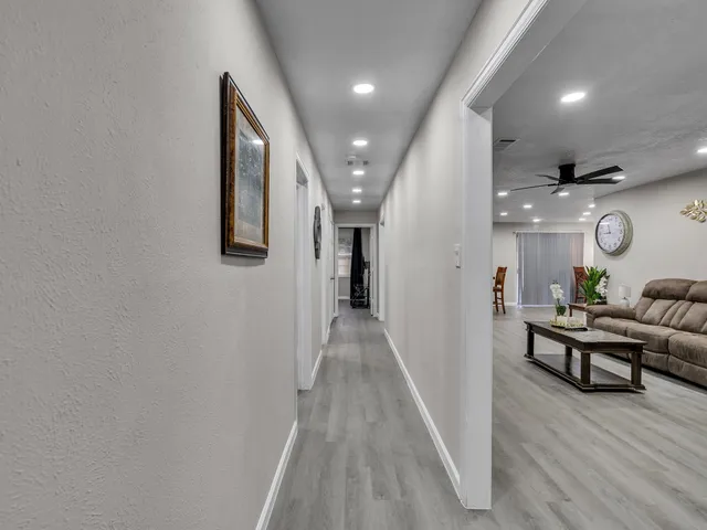 an entryway and livingroom with furniture
