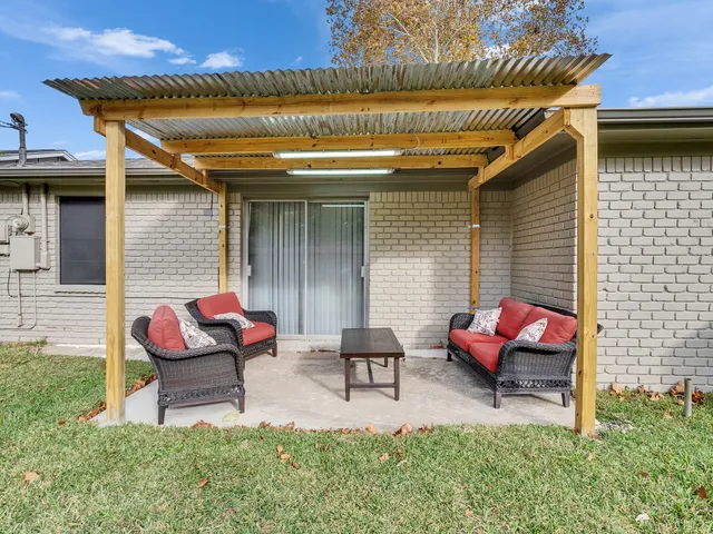 a backyard of a house with seating space