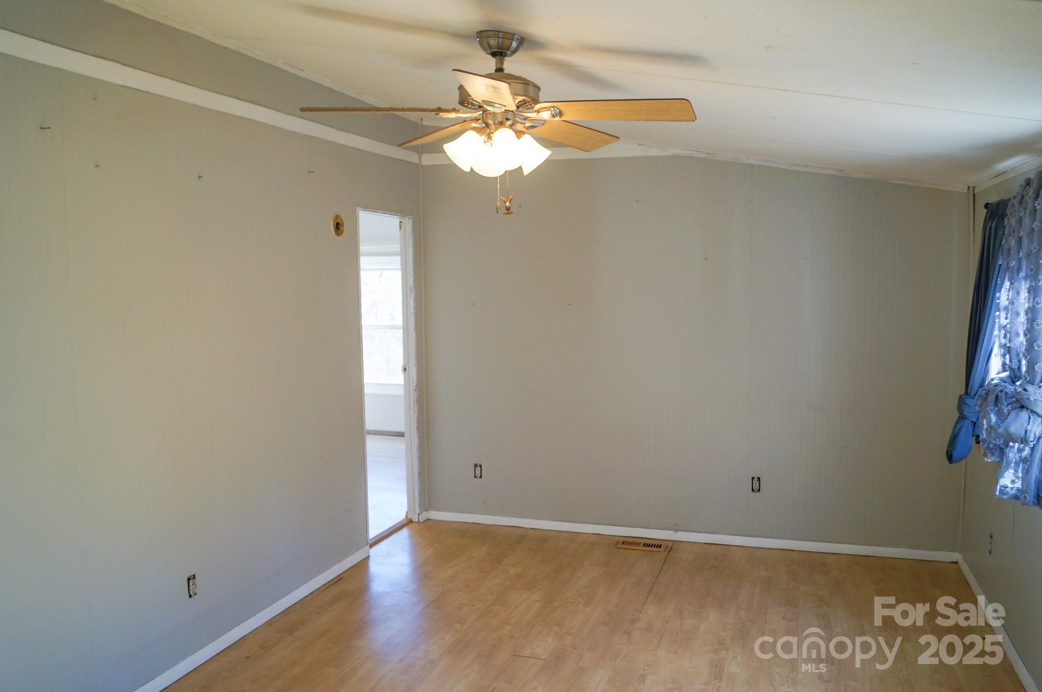 105 Lane Street Morganton, NC 28655 - Photo 11 of 19 an empty room with windows and fan