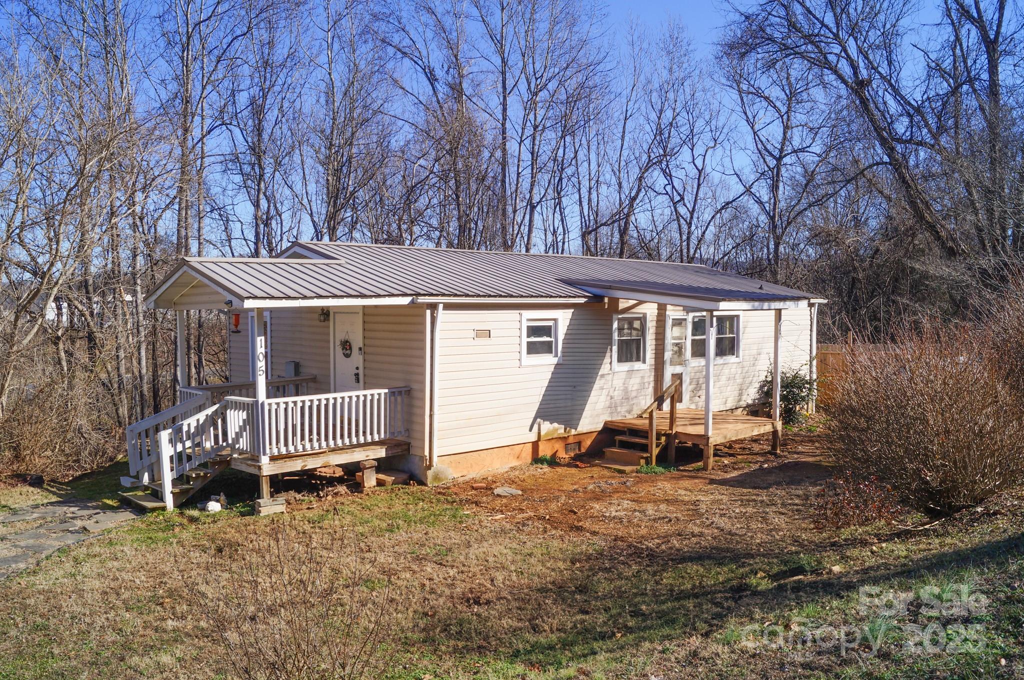105 Lane Street Morganton, NC 28655 - Photo 3 of 19 a view of a house with backyard and chair