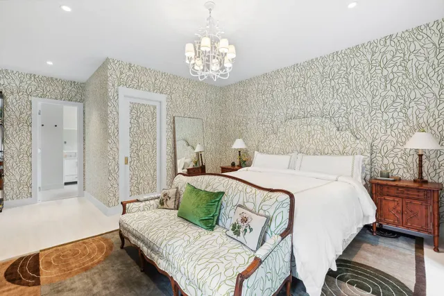 a bathroom with a granite countertop sink a toilet and shower