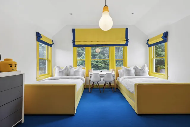 a bedroom with a bed and a table