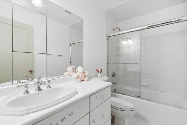a living room with furniture a rug and a chandelier