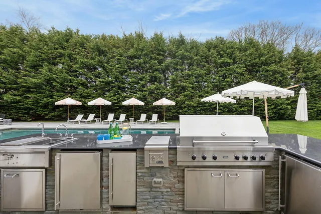swimming pool view with a garden space