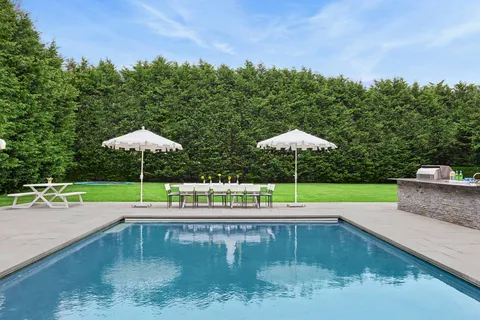 a view of a swimming pool from a balcony