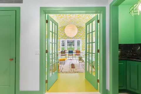 a room with furniture and a swimming pool