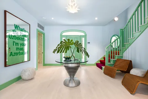 a view of a dining room with furniture window and outside view