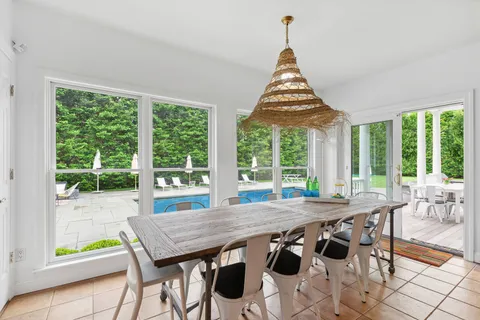 a kitchen with stainless steel appliances granite countertop a sink a stove and cabinets