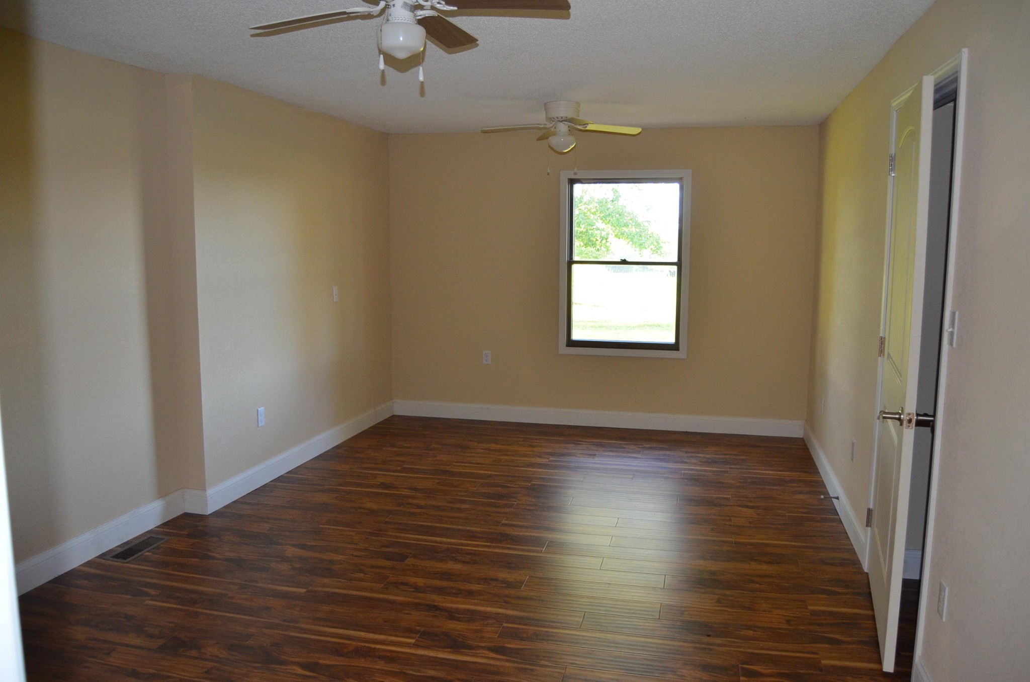 190 Meister Hills Road Deer Lodge, TN 37726 - Photo 17 of 40 a view of an empty room with wooden floor and a window
