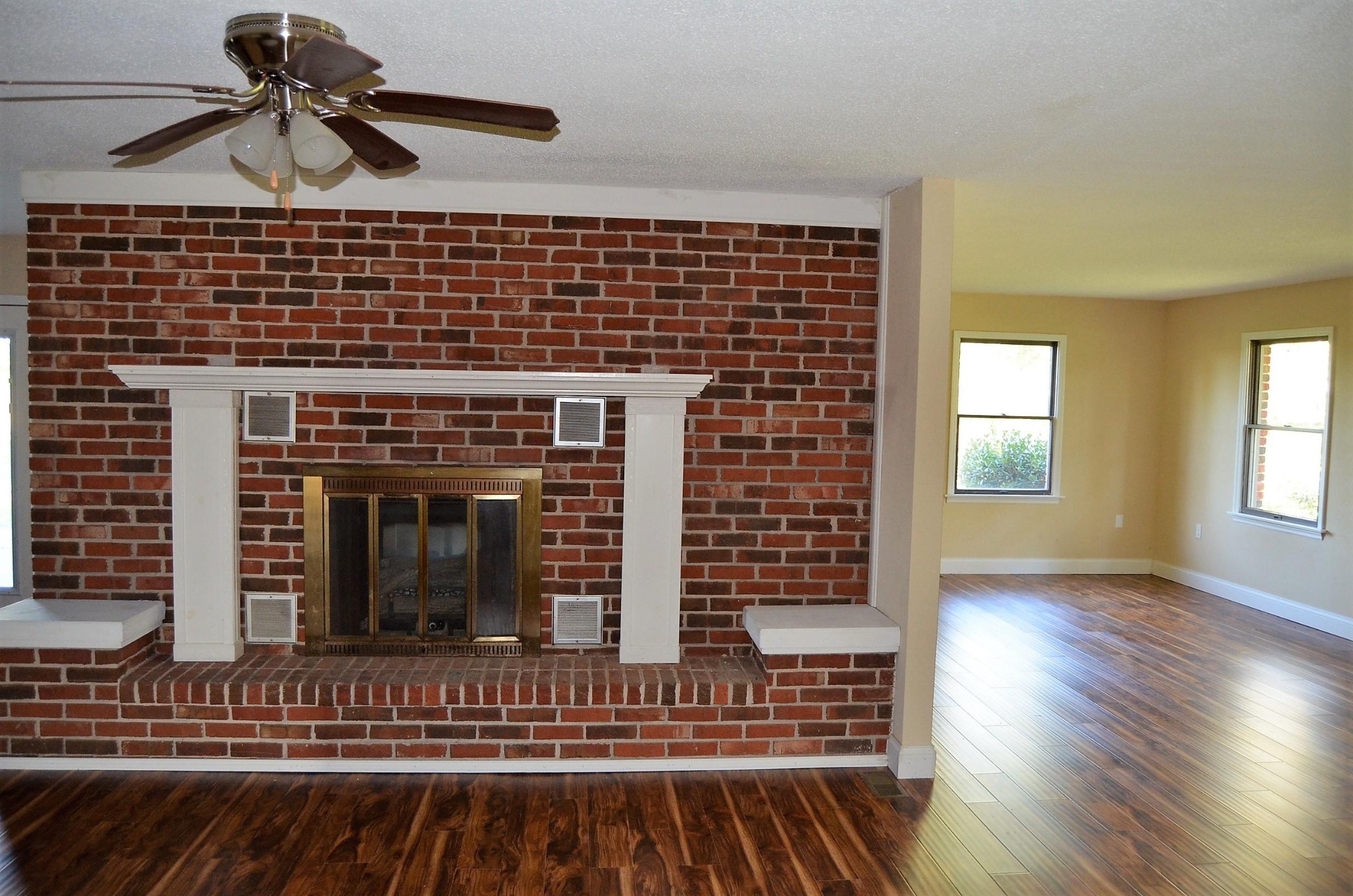 190 Meister Hills Road Deer Lodge, TN 37726 - Photo 5 of 40 a view of a livingroom with wooden floor and a fireplace
