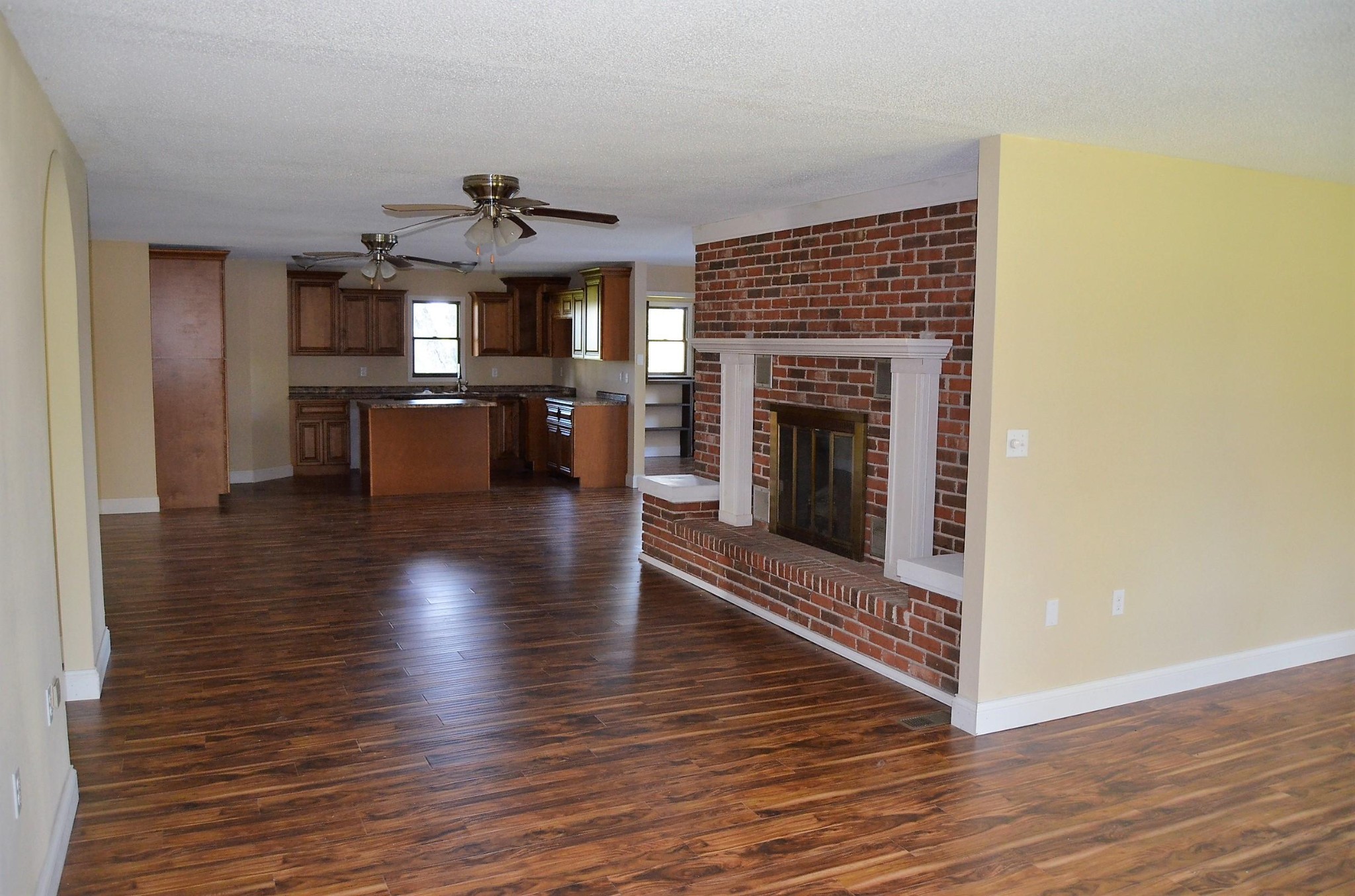 190 Meister Hills Road Deer Lodge, TN 37726 - Photo 6 of 40 a view of a livingroom with furniture wooden floor fireplace and a window
