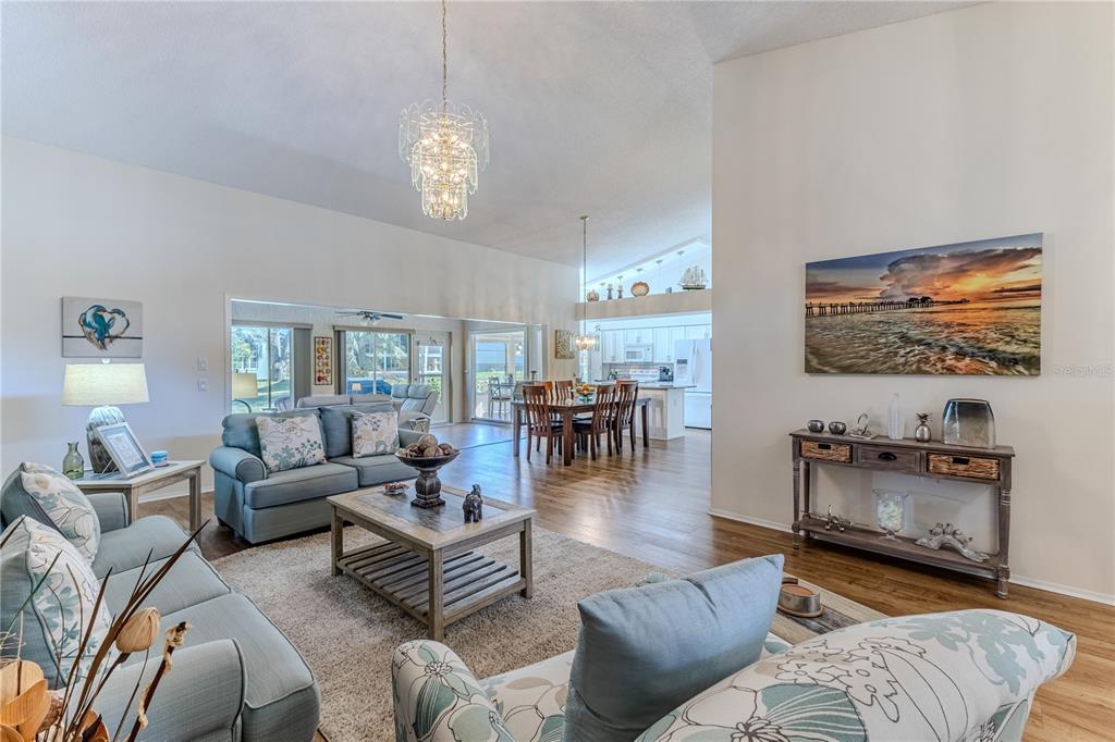 7443 Willowbrook Drive Spring Hill, FL 34606 - Photo 11 of 54 a living room with furniture and a flat screen tv
