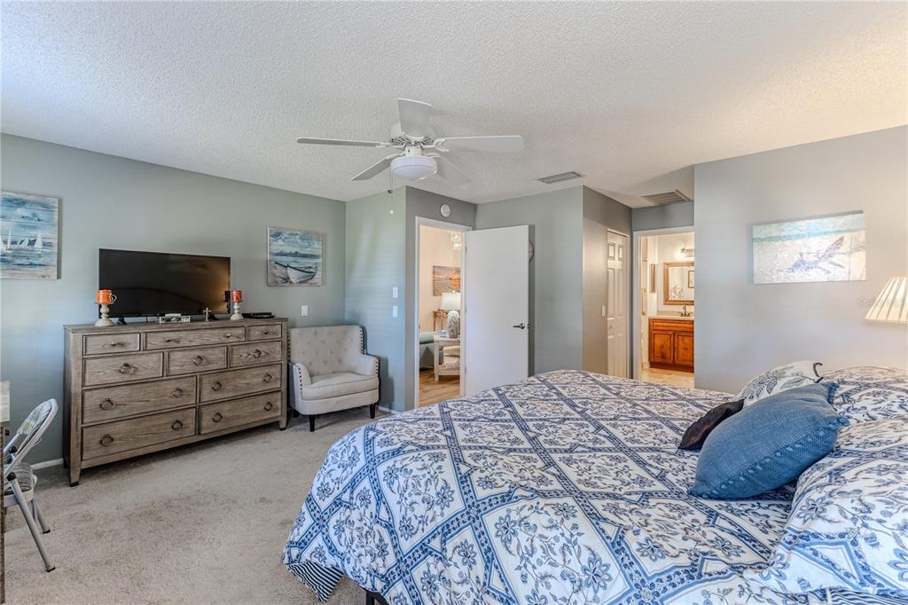 7443 Willowbrook Drive Spring Hill, FL 34606 - Photo 23 of 54 a bedroom with a bed and flat screen tv