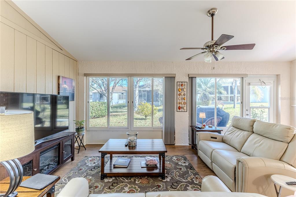 7443 Willowbrook Drive Spring Hill, FL 34606 - Photo 35 of 54 a living room with furniture and a window
