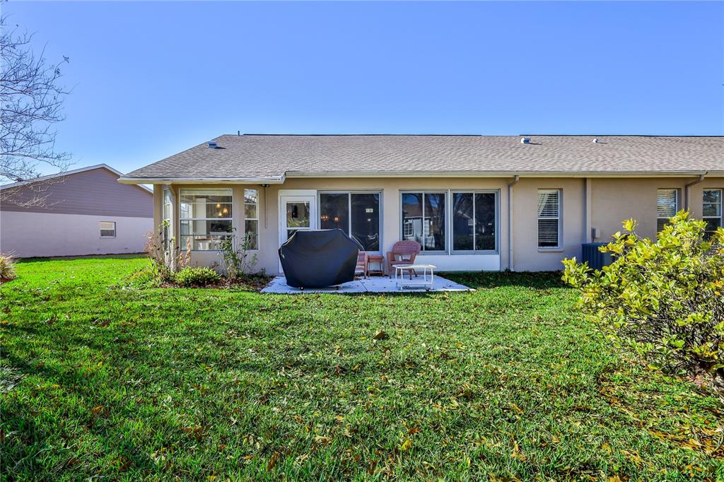 7443 Willowbrook Drive Spring Hill, FL 34606 - Photo 38 of 54 a house view with a garden space