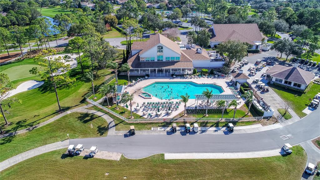 7443 Willowbrook Drive Spring Hill, FL 34606 - Photo 43 of 54 an aerial view of a house with a garden and swimming pool