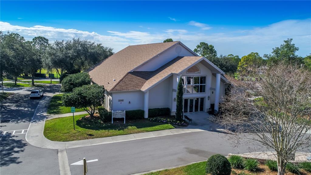 7443 Willowbrook Drive Spring Hill, FL 34606 - Photo 45 of 54 a front view of a house with a yard