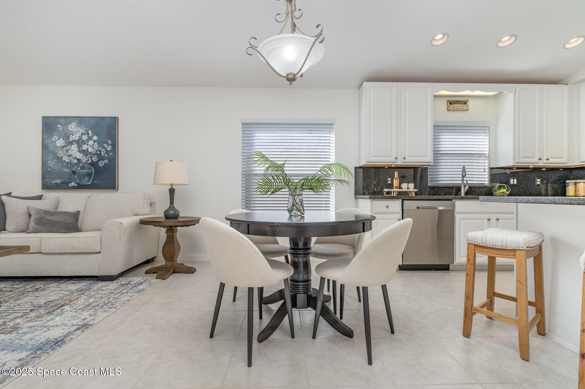 3053 Galindo Circle Melbourne, FL 32940 - Photo 12 of 83 a view of a dining room with furniture and wooden floor