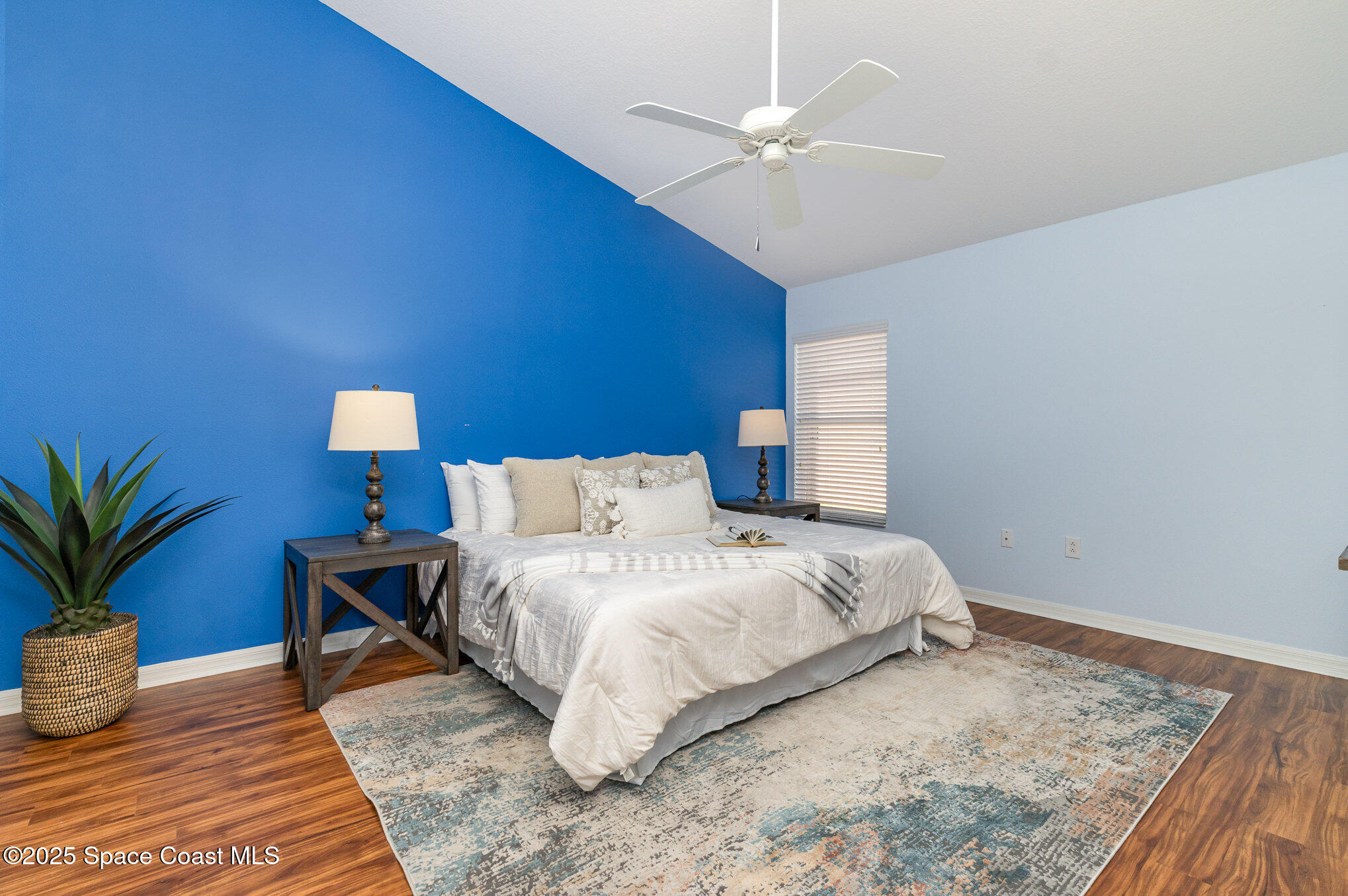 3053 Galindo Circle Melbourne, FL 32940 - Photo 21 of 83 a bedroom with bed and a potted plant