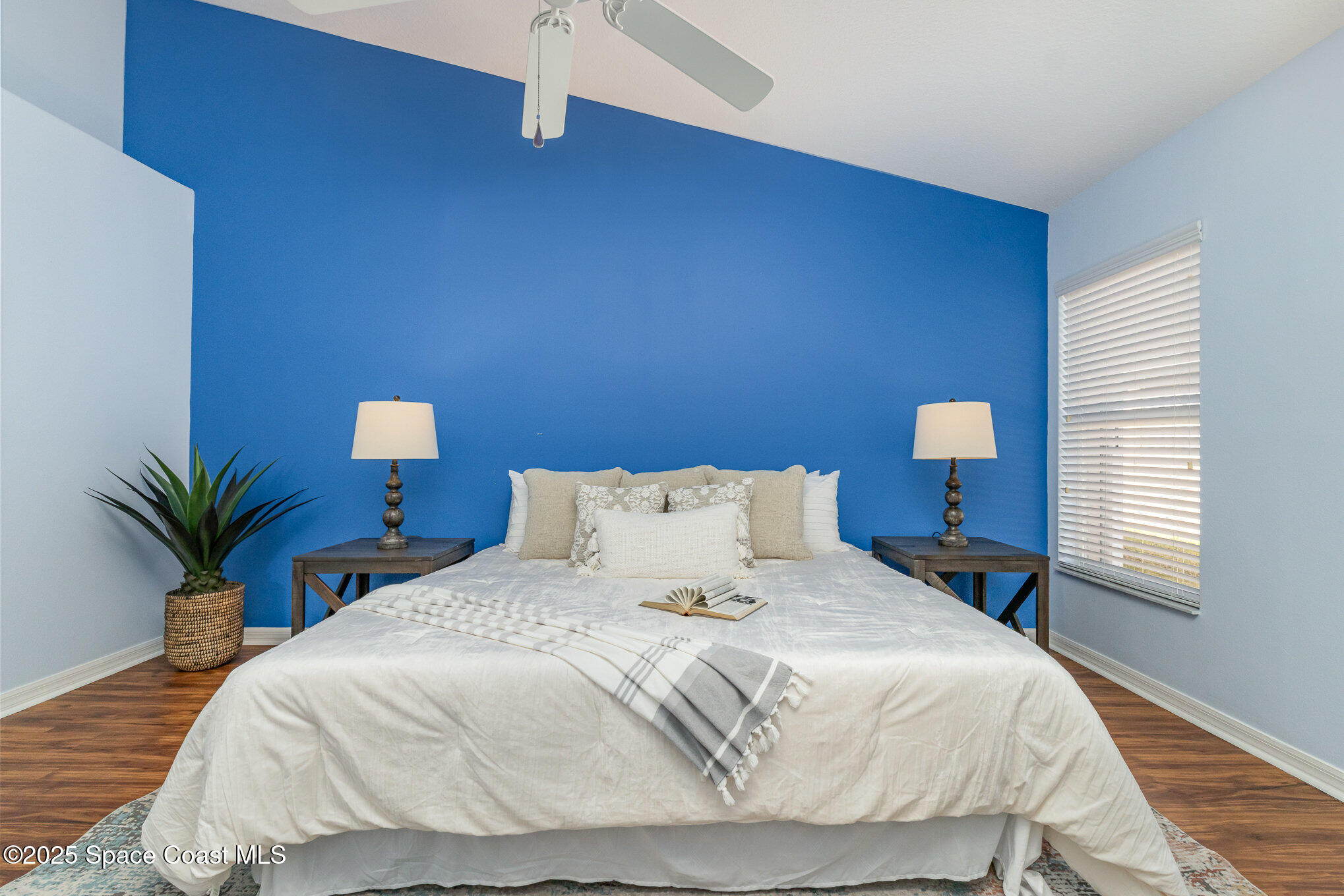 3053 Galindo Circle Melbourne, FL 32940 - Photo 22 of 83 a bedroom with a bed and a potted plant