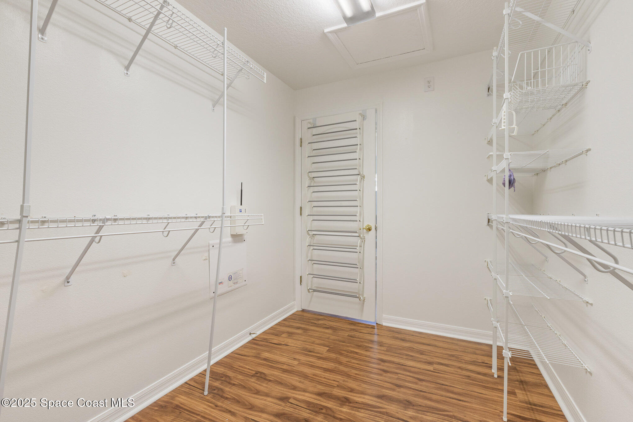3053 Galindo Circle Melbourne, FL 32940 - Photo 25 of 83 a view of walk in closet with empty racks
