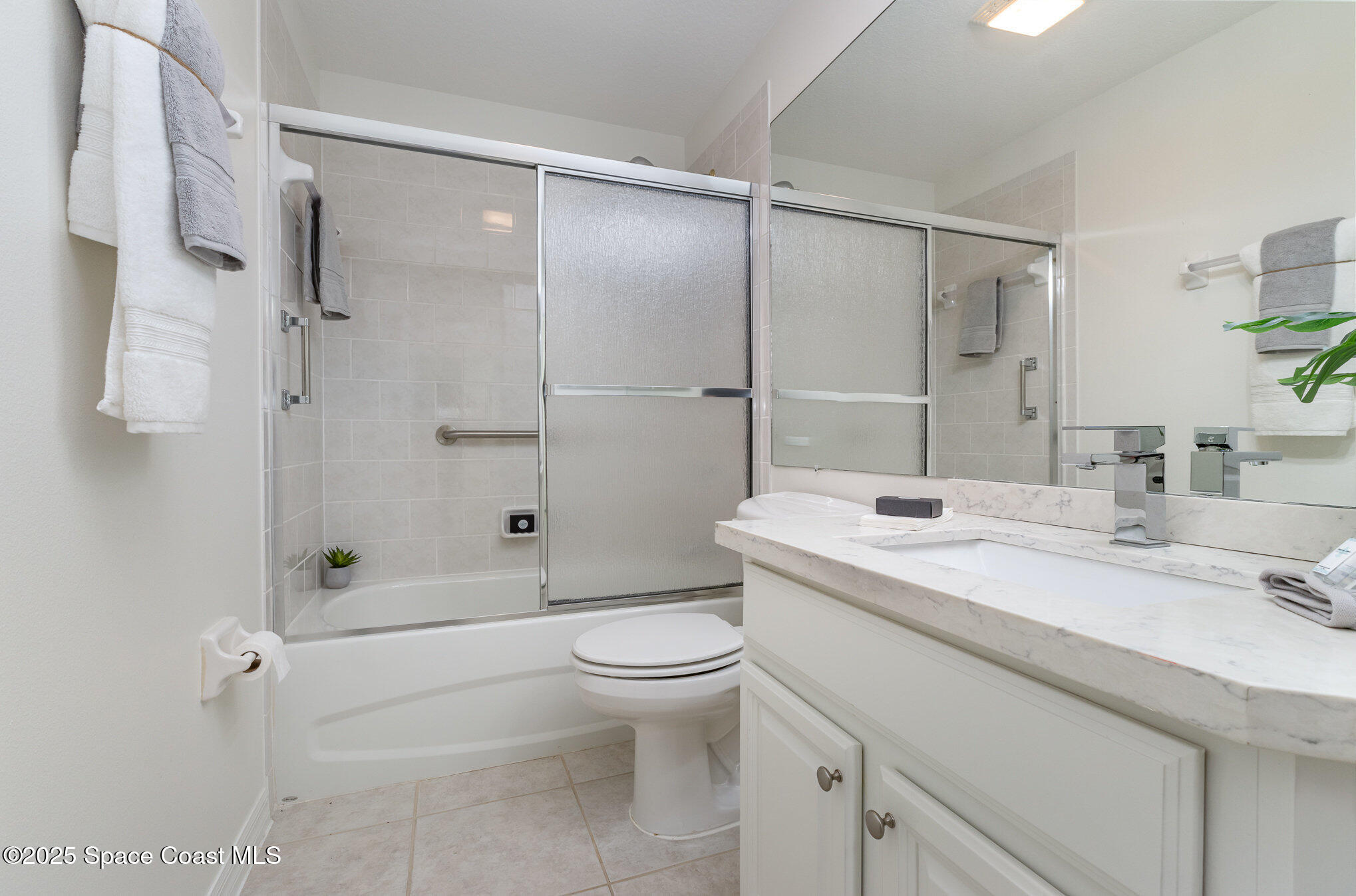 3053 Galindo Circle Melbourne, FL 32940 - Photo 28 of 83 a bathroom with a sink a toilet and shower