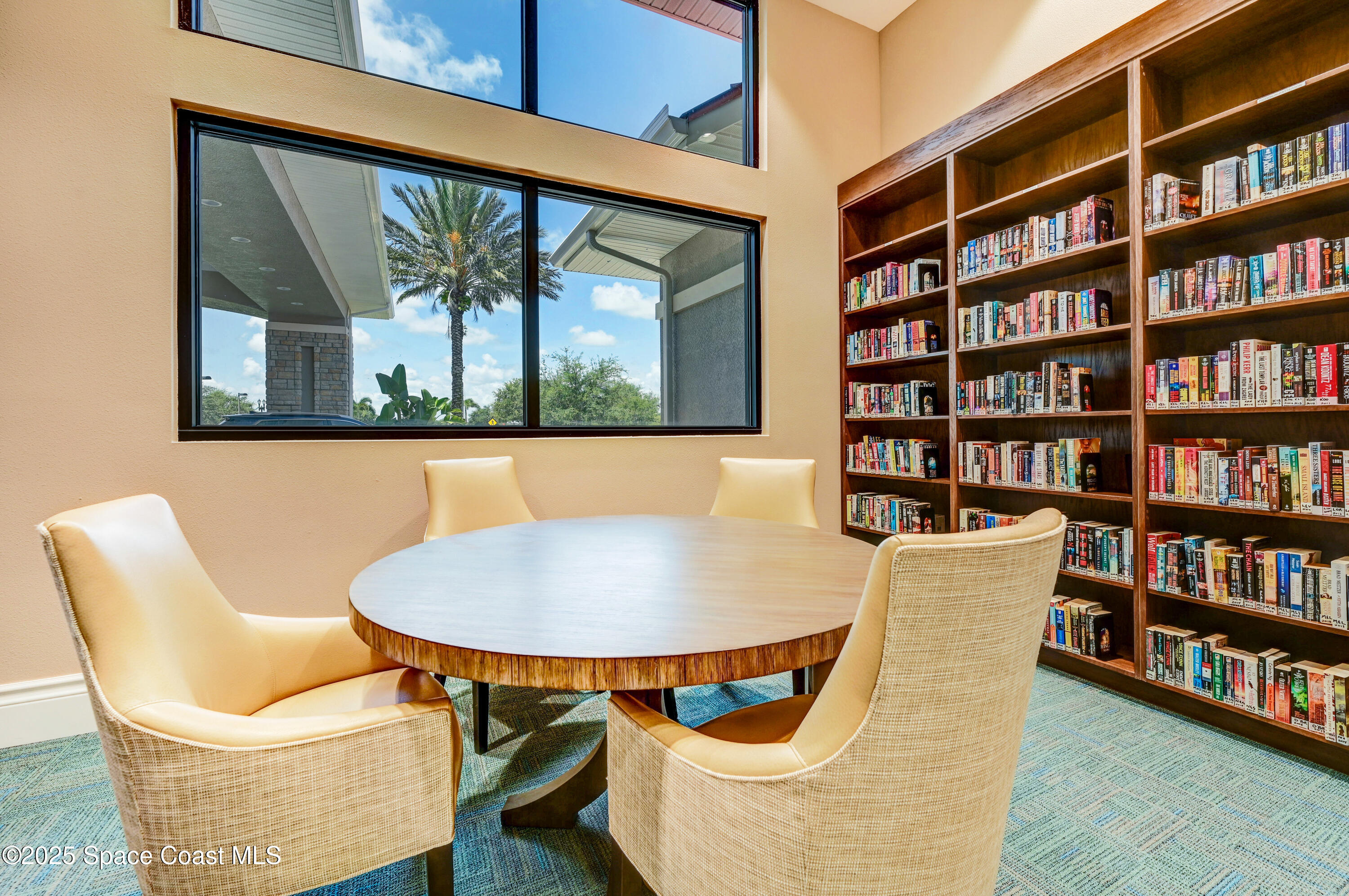 3053 Galindo Circle Melbourne, FL 32940 - Photo 52 of 83 a view of a dining room with furniture and a book shelf