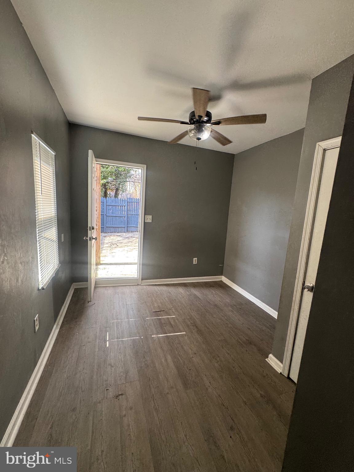 1108 North Bond Street, Unit 1 Baltimore, MD 21213 - Photo 17 of 20 wooden floor in an empty room with a window