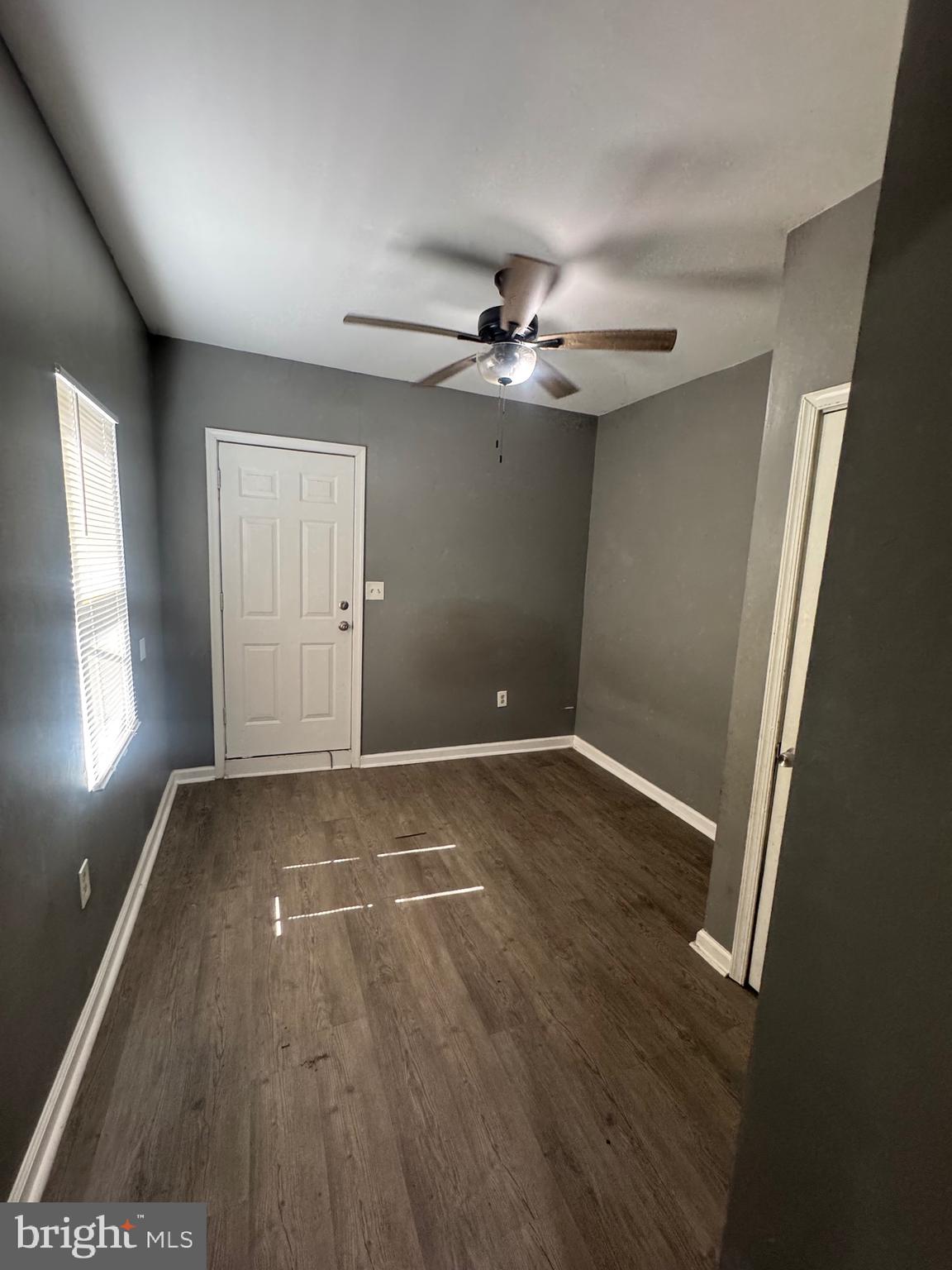 1108 North Bond Street, Unit 1 Baltimore, MD 21213 - Photo 19 of 20 wooden floor in an empty room with a window