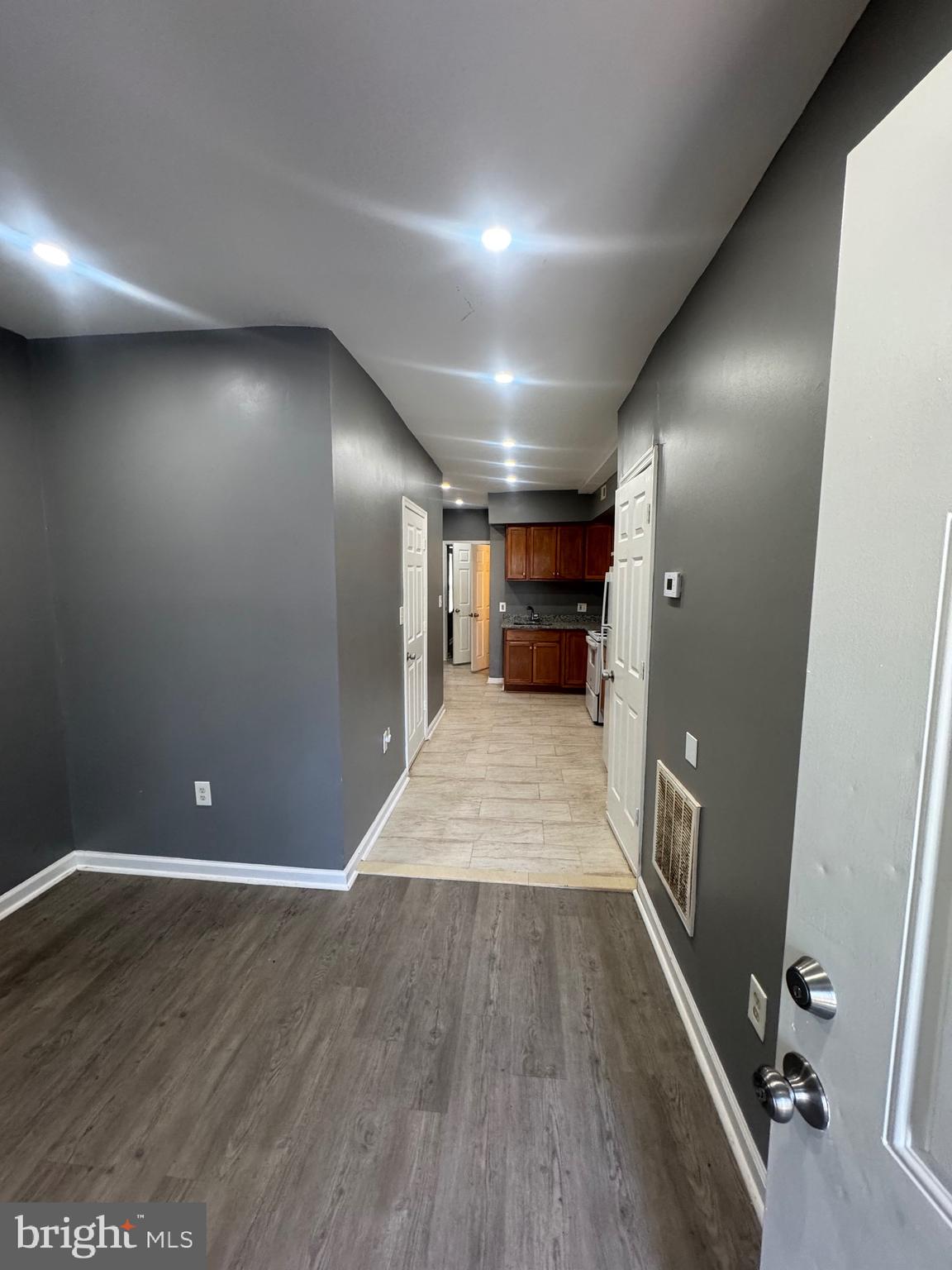 1108 North Bond Street, Unit 1 Baltimore, MD 21213 - Photo 6 of 20 a view of empty room with wooden floor