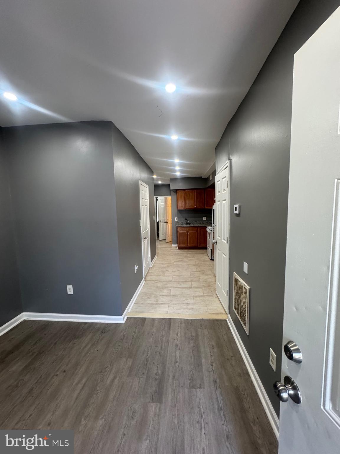 1108 North Bond Street, Unit 1 Baltimore, MD 21213 - Photo 7 of 20 a view of empty room with wooden floor