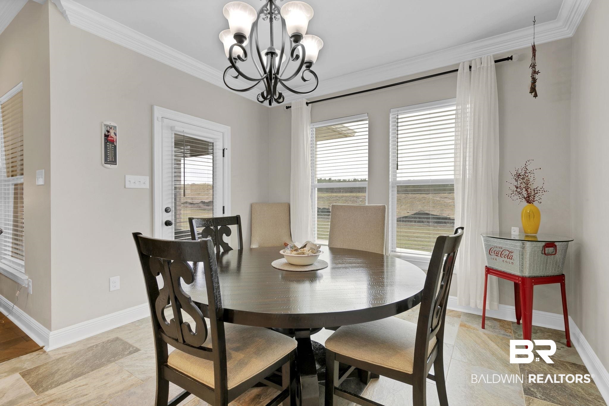 11247 Thistledown Loop Spanish Fort, AL 36527 - Photo 20 of 72 Dining space featuring plenty of natural light, ornamental molding, and baseboards