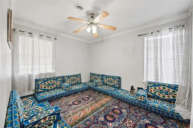 a bedroom with bed and a window