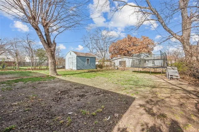 a house that has a tree in front of it