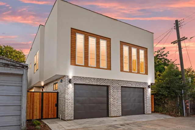 a front view of a house with garage