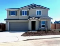 a front view of a house with a garage