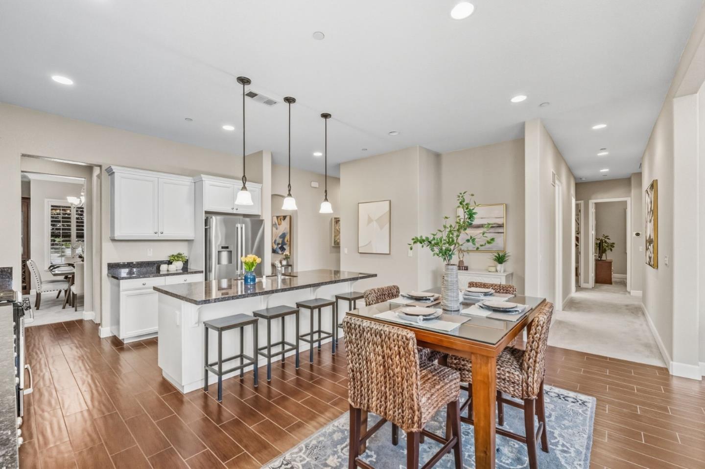 3716 Chiavari Way Manteca, CA 95337 - Photo 17 of 71 a dining room with furniture and wooden floor