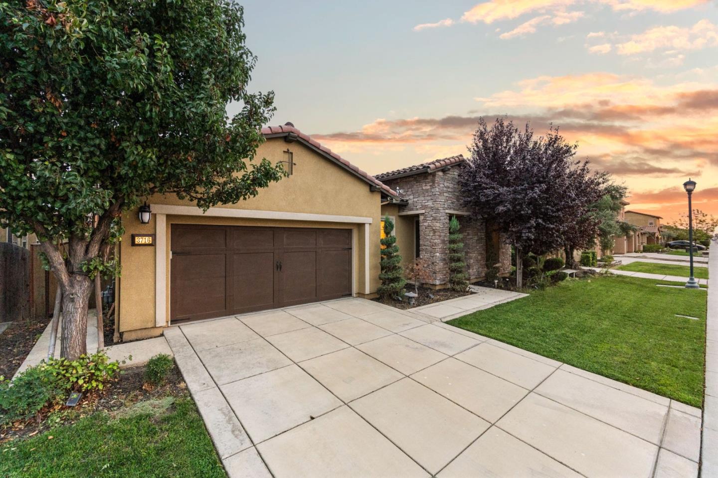 3716 Chiavari Way Manteca, CA 95337 - Photo 2 of 71 a front view of a house with a yard and garage