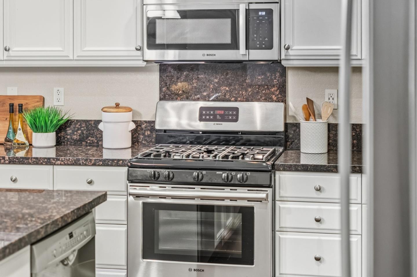 3716 Chiavari Way Manteca, CA 95337 - Photo 22 of 71 a stove top oven sitting inside of a kitchen