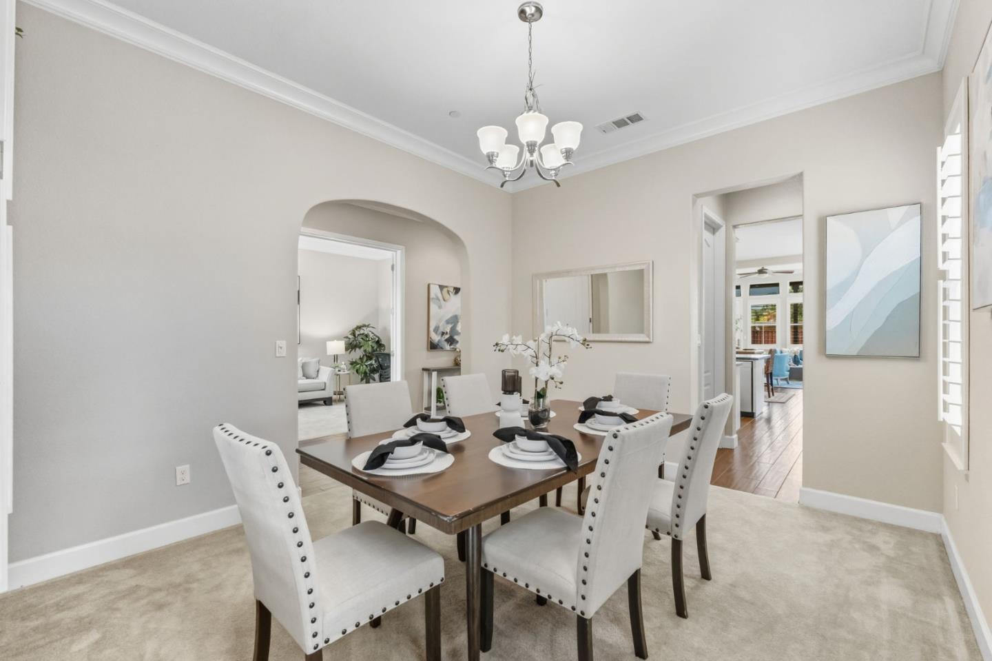 3716 Chiavari Way Manteca, CA 95337 - Photo 31 of 71 a view of a dining room with furniture and chandelier
