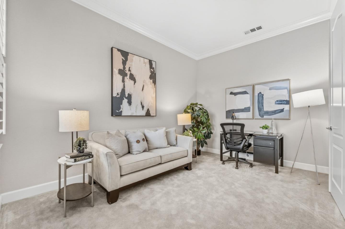 3716 Chiavari Way Manteca, CA 95337 - Photo 37 of 71 a living room with furniture and a painting on the wall