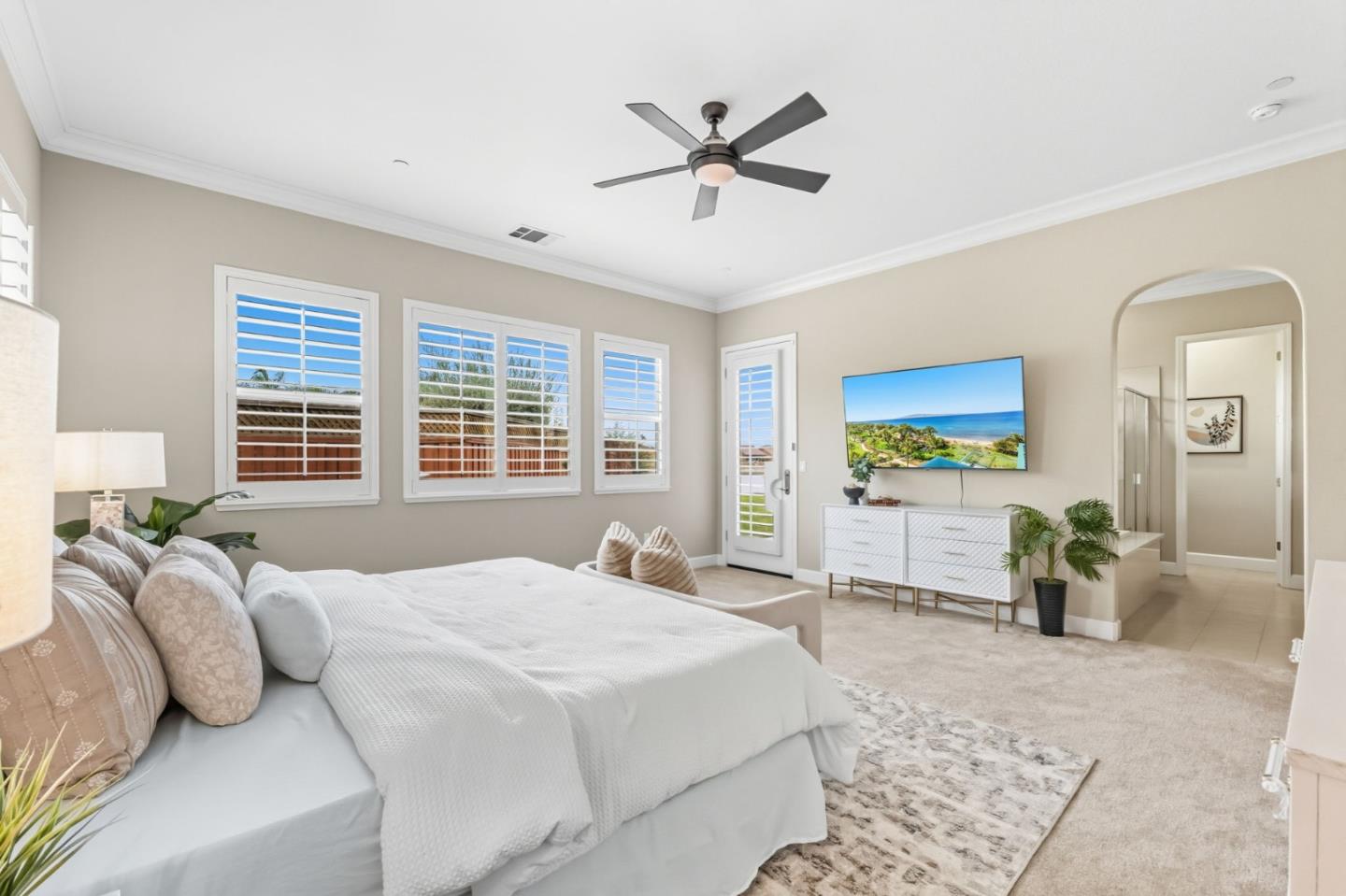 3716 Chiavari Way Manteca, CA 95337 - Photo 46 of 71 a bedroom with a balcony a bed and a chandelier